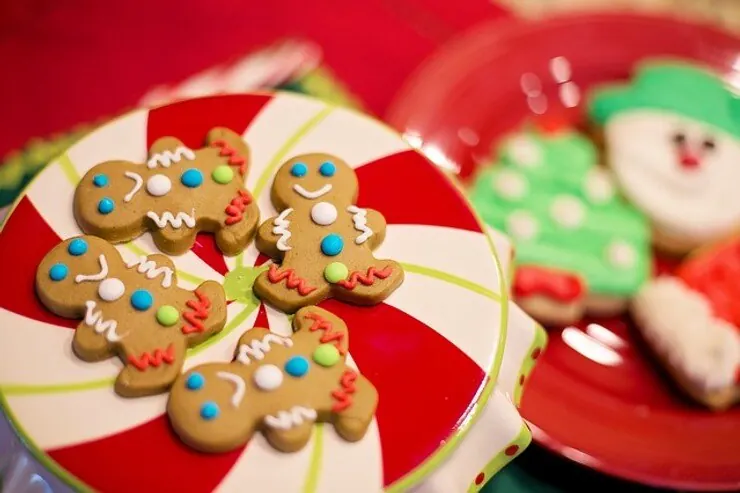 Decorated gingerbread and snowman cookies on a plate
